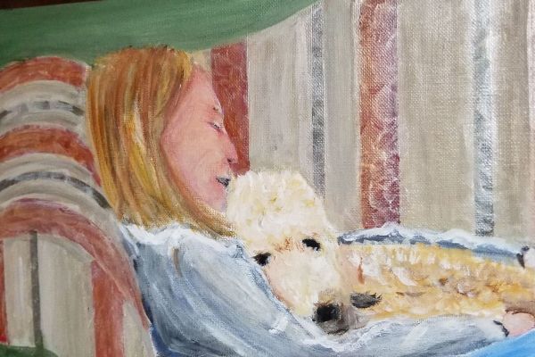 Woman and dog lounging on couch